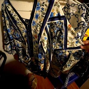 A blue floral blouse that has been worn a few times